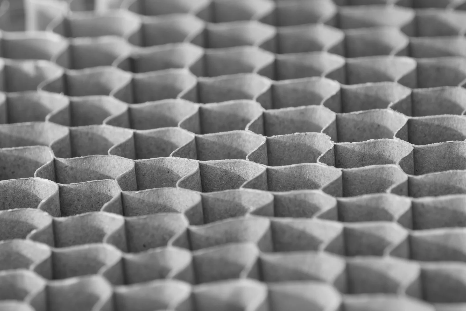 Close-up of corrugated cardboard fluting between kraft liners